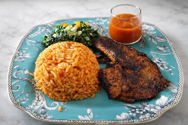 Ngesh Cuisine plated rice, greens, and grilled fish